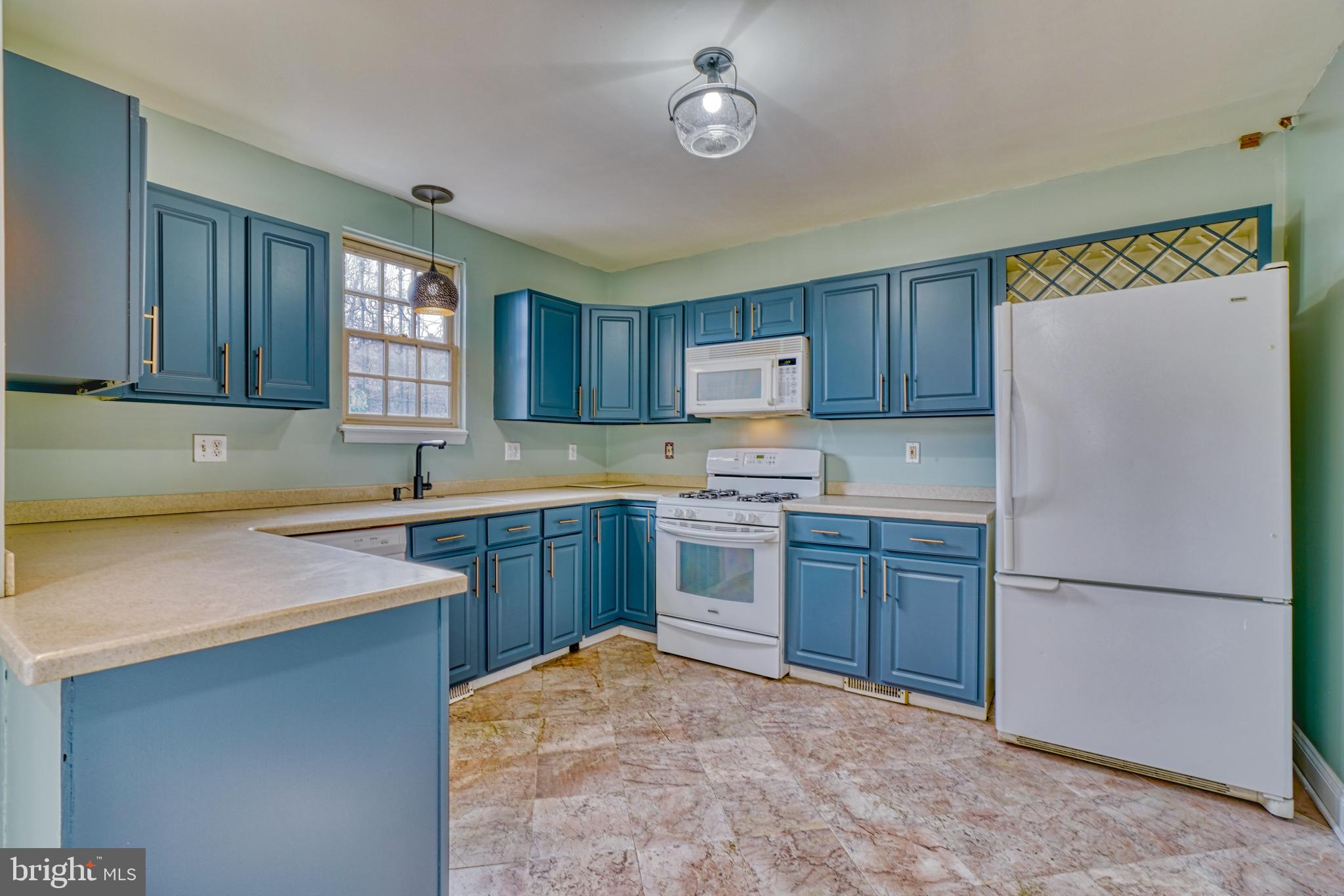 644 Jasper Street Baltimore, MD 21201 - Photo 9 of 27 a kitchen with a refrigerator stove top oven and sink