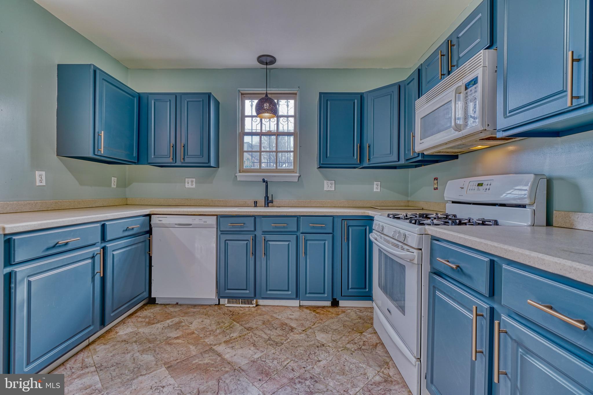 644 Jasper Street Baltimore, MD 21201 - Photo 10 of 27 a kitchen with stainless steel appliances granite countertop a sink stove and cabinets