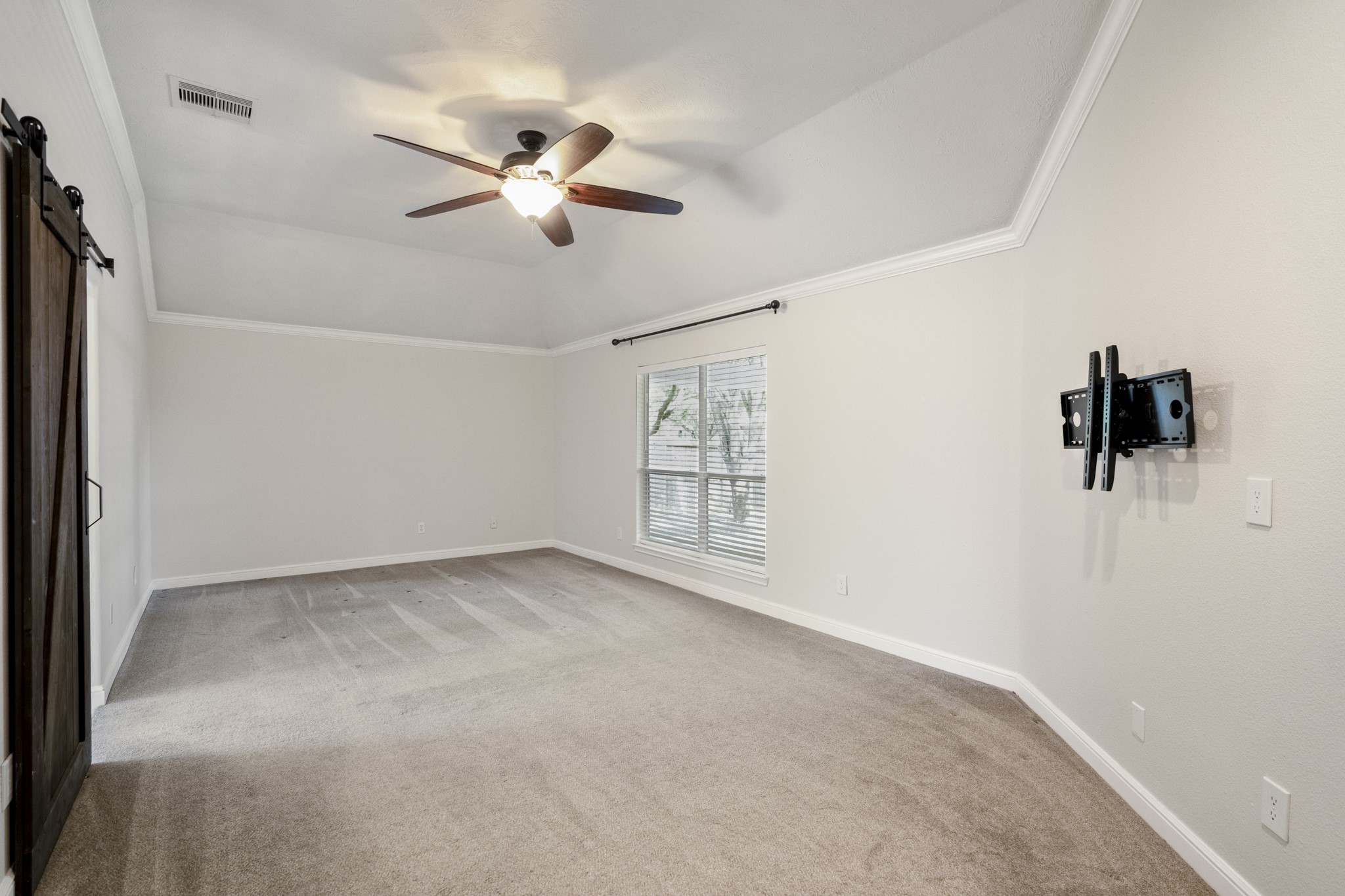 5802 Sawyer Bend Lane Spring, TX 77379 - Photo 18 of 50 a view of a room with a ceiling fan and a window