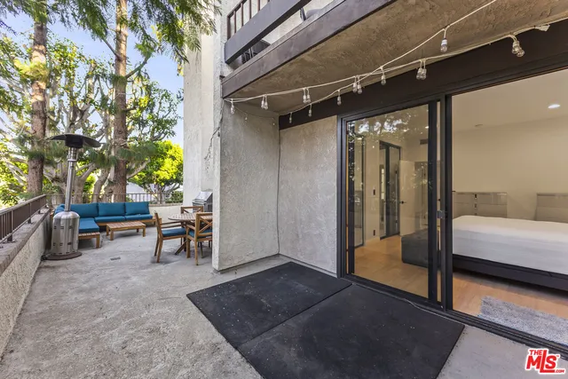 a view of living room with furniture and a rug