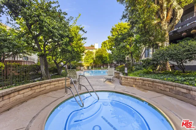 a view of a swimming pool with a patio