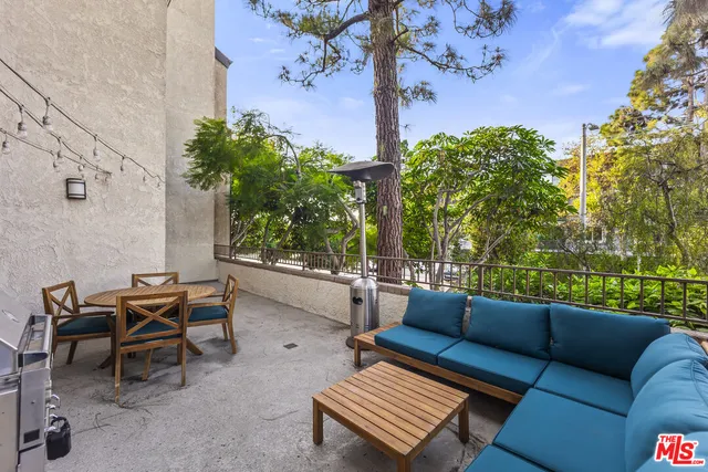 a outdoor living space with furniture and a potted plant