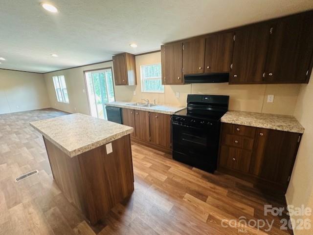 3567 Ken McEntire Road Shelby, NC 28150 - Photo 5 of 20 a kitchen with granite countertop a sink and a stove top oven