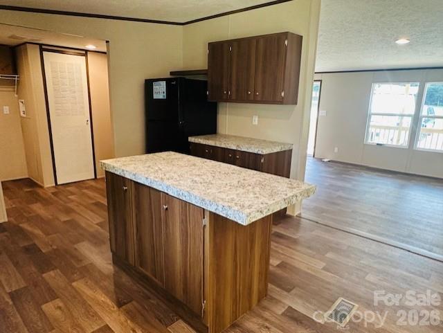 3567 Ken McEntire Road Shelby, NC 28150 - Photo 6 of 20 a kitchen with granite countertop wooden cabinets a refrigerator and a sink