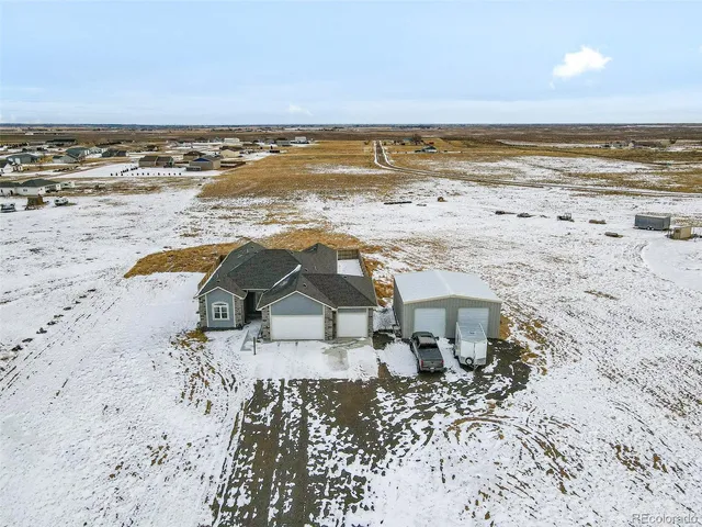 a kitchen with stainless steel appliances a refrigerator and microwave