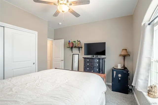 a open kitchen with stainless steel appliances kitchen island granite countertop a stove and a refrigerator