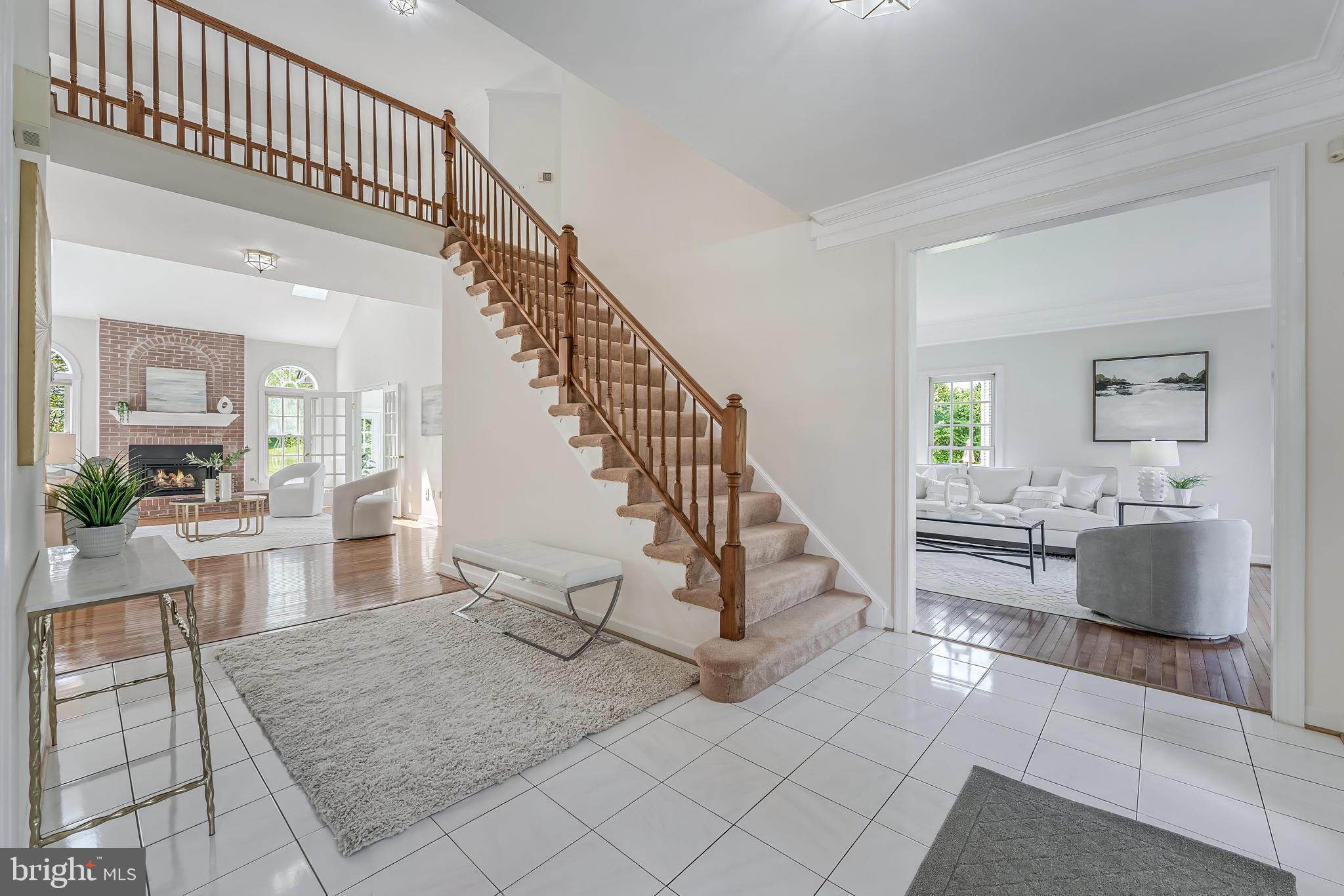 5501 Ashleigh Road Fairfax, VA 22030 - Photo 5 of 77 a view of staircase and living room with wooden floor