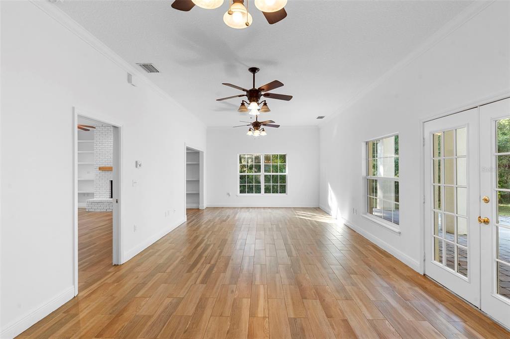 4855 Lillian Black Road St. Cloud, FL 34771 - Photo 13 of 62 a view of an empty room with wooden floor and a window