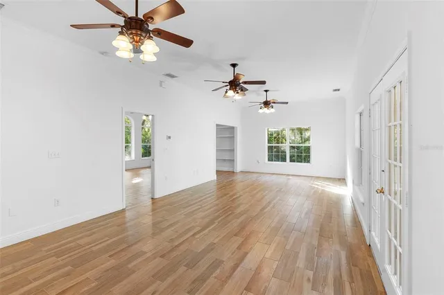 a view of an entryway with wooden floor