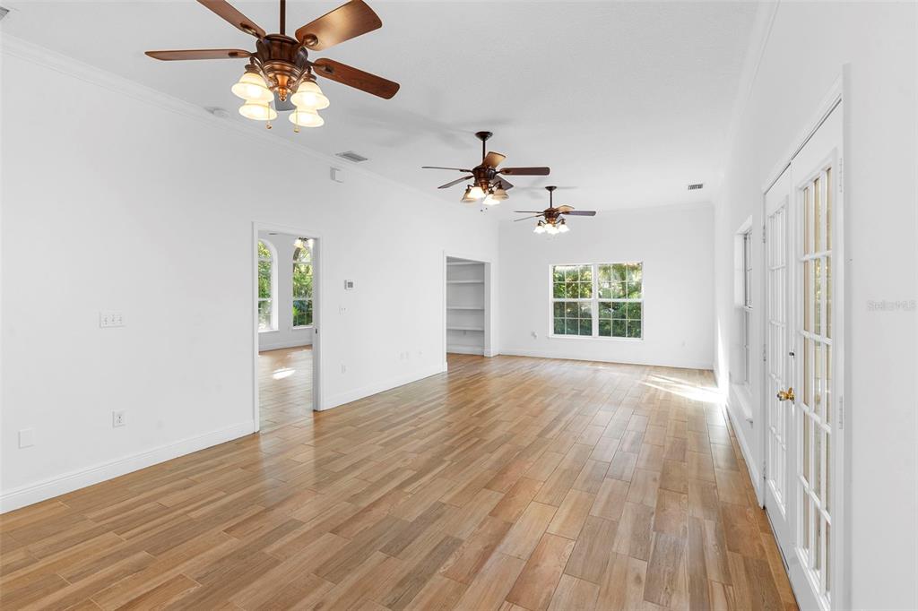 4855 Lillian Black Road St. Cloud, FL 34771 - Photo 15 of 62 a view of an empty room with a window and wooden floor