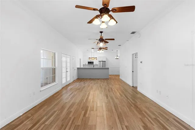 a kitchen with stainless steel appliances granite countertop a sink refrigerator and microwave