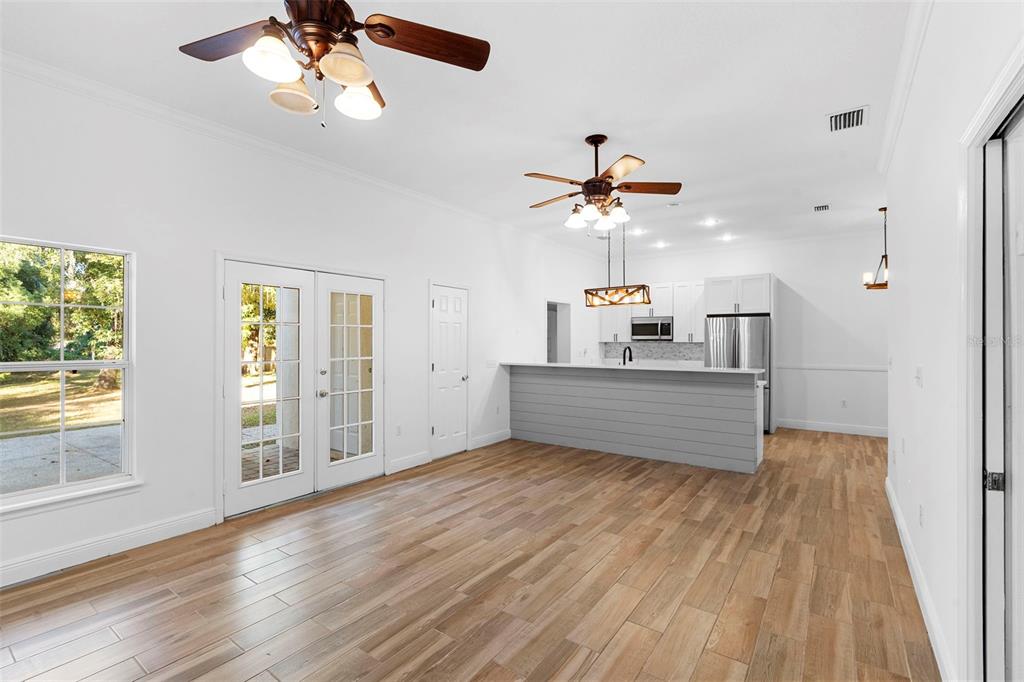 4855 Lillian Black Road St. Cloud, FL 34771 - Photo 20 of 62 an empty room with chandelier fan and windows