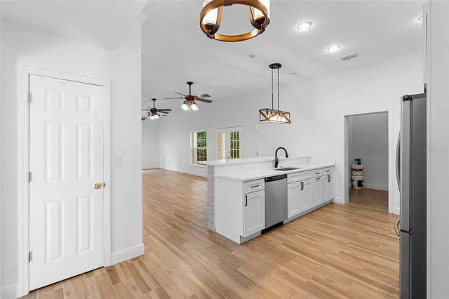 a bathroom with a toilet sink and shower