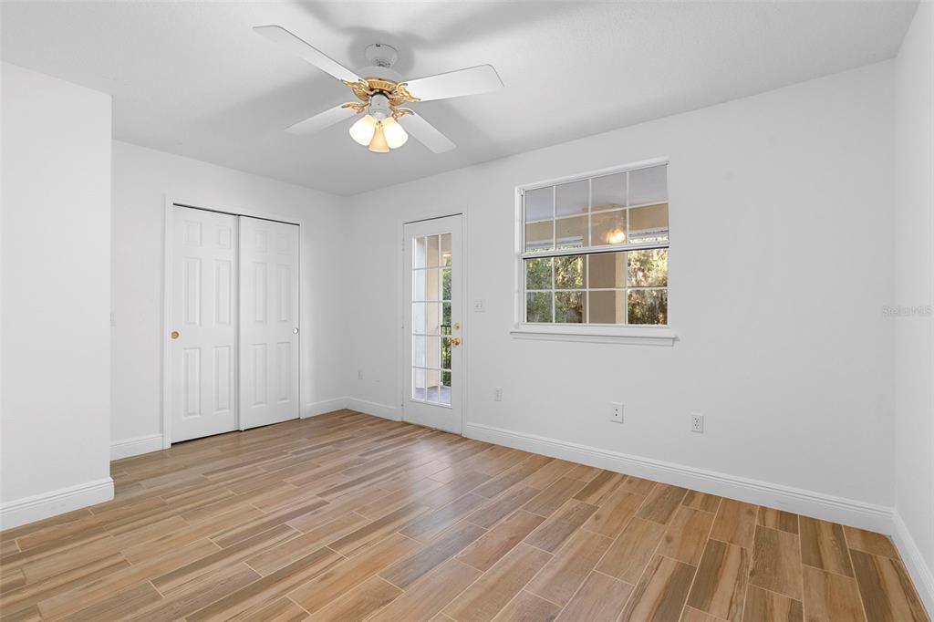 4855 Lillian Black Road St. Cloud, FL 34771 - Photo 31 of 62 a view of an empty room with wooden floor and a window