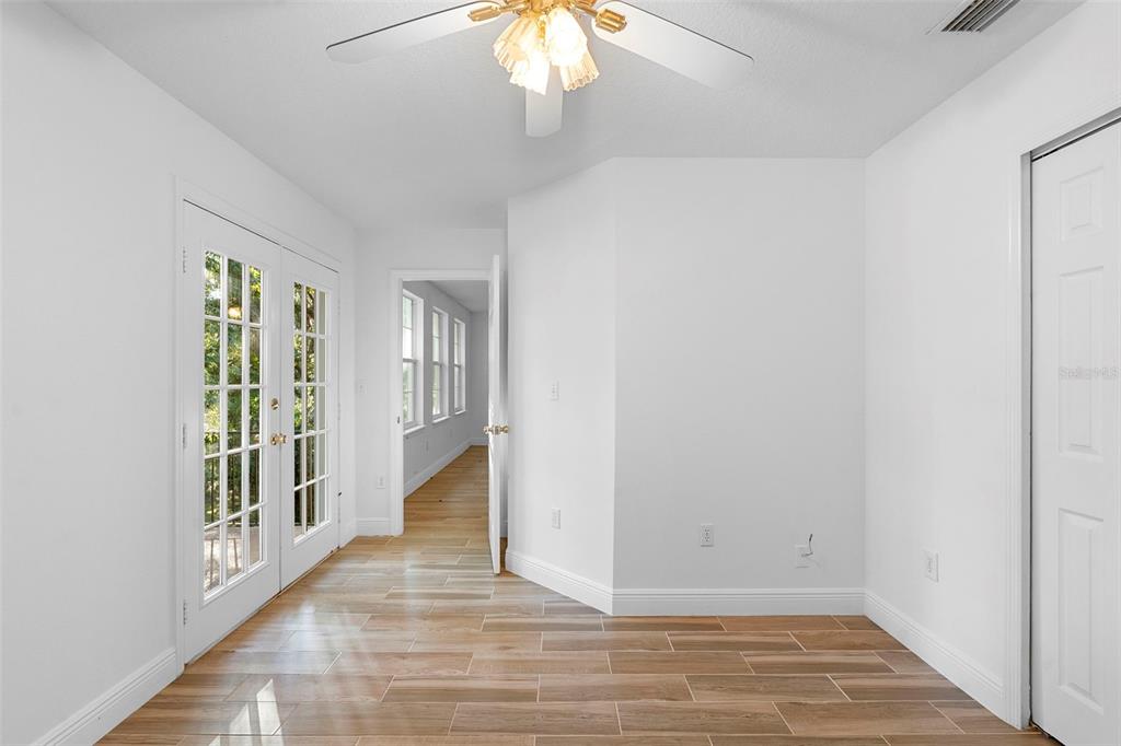 4855 Lillian Black Road St. Cloud, FL 34771 - Photo 45 of 62 a view of an empty room with wooden floor and a window