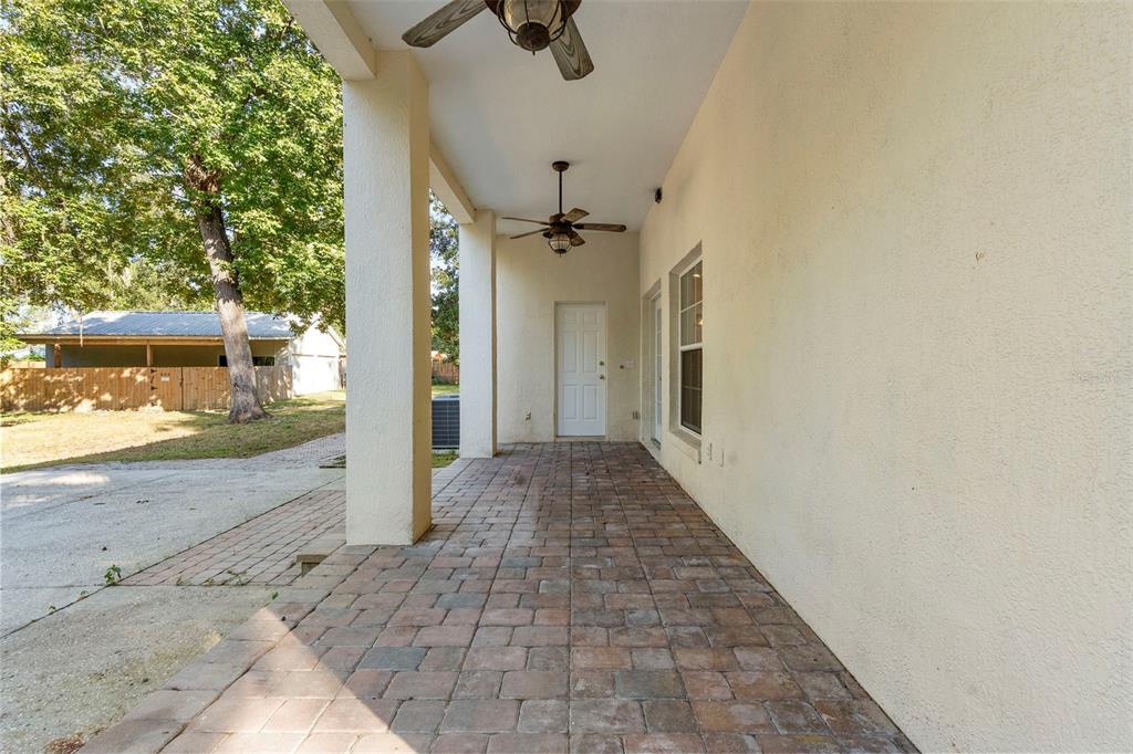 4855 Lillian Black Road St. Cloud, FL 34771 - Photo 48 of 62 a view of a hallway with a outdoor space