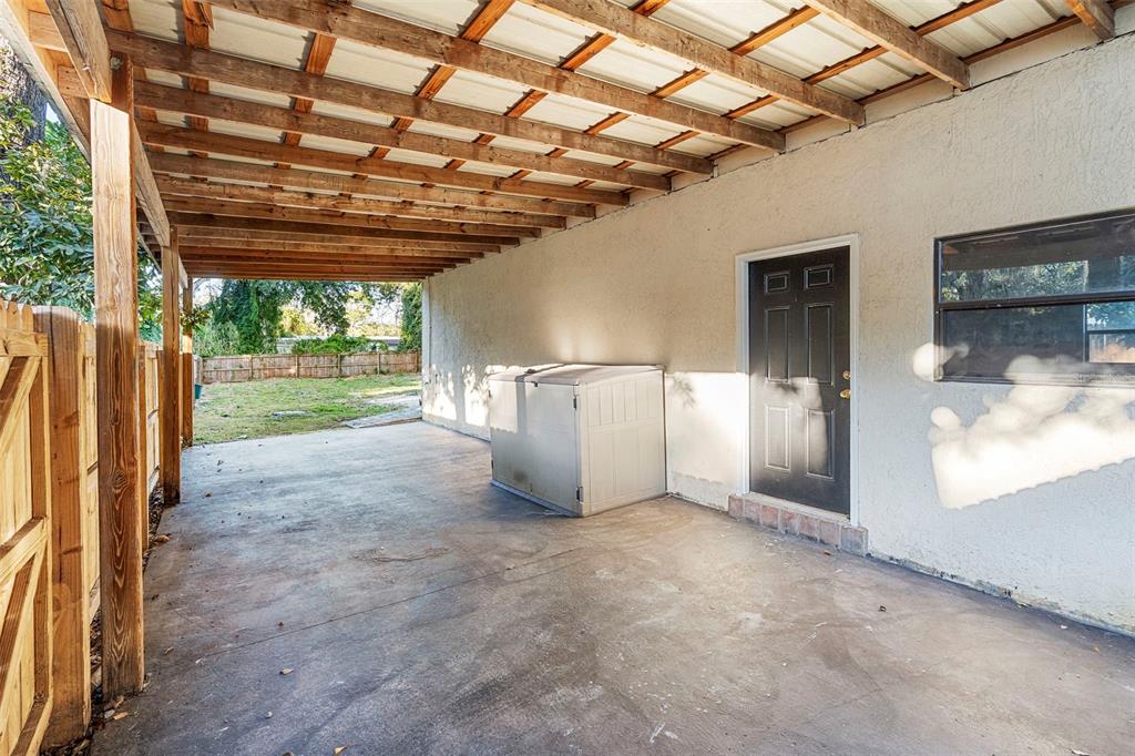 4855 Lillian Black Road St. Cloud, FL 34771 - Photo 49 of 62 a view of a room with wooden walls and sliding door