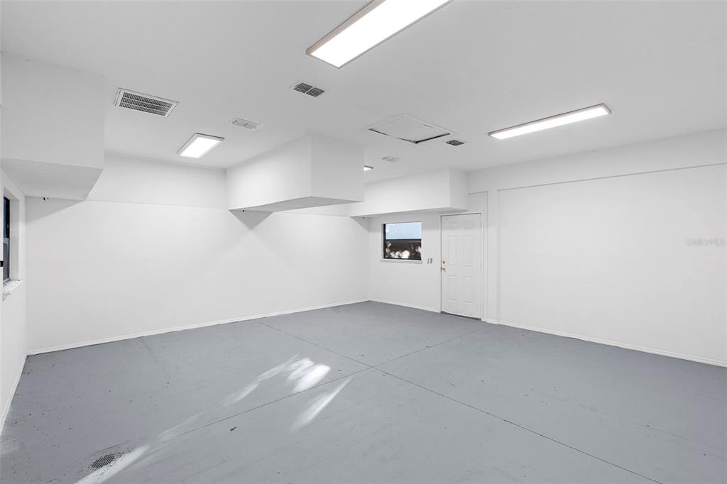 4855 Lillian Black Road St. Cloud, FL 34771 - Photo 55 of 62 an empty room with a empty space and windows