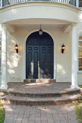 a view of empty room with wooden floor and fireplace