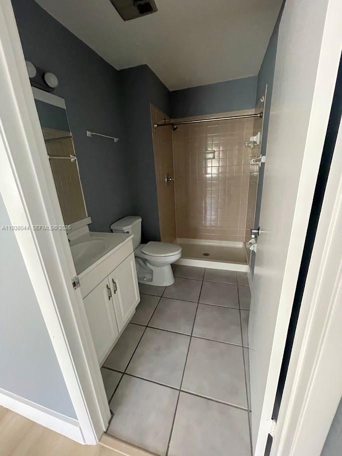 15330 Southwest 72nd Street, Unit 721 Miami, FL 33193 - Photo 12 of 14 a bathroom with a toilet and a shower