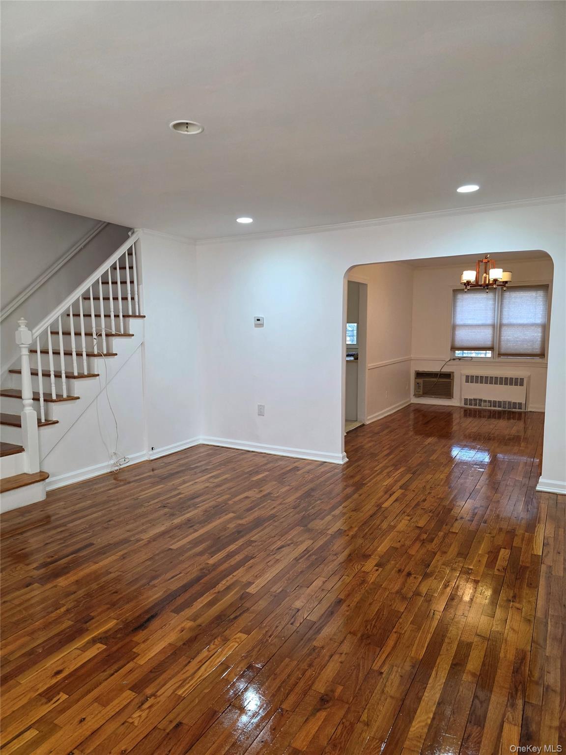 150-25 77th Road Queens, NY 11367 - Photo 2 of 12 a view of a kitchen with wooden floor and a sink