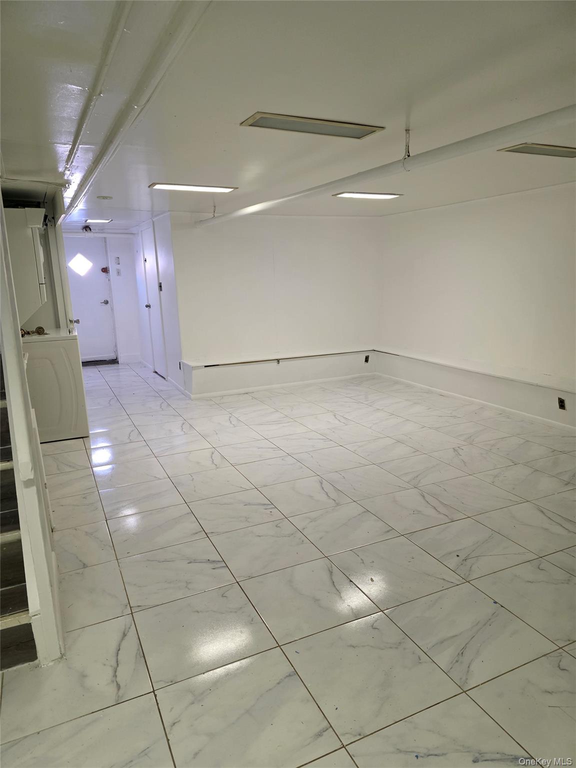 150-25 77th Road Queens, NY 11367 - Photo 8 of 12 a view of a livingroom with white furniture