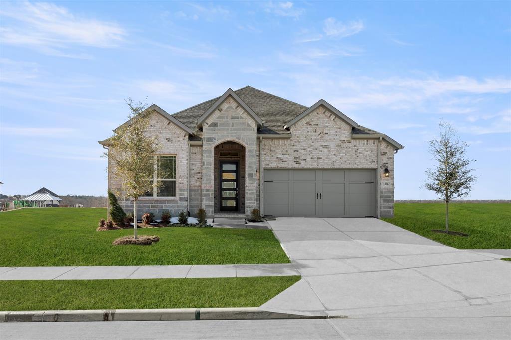 a front view of a house with garage
