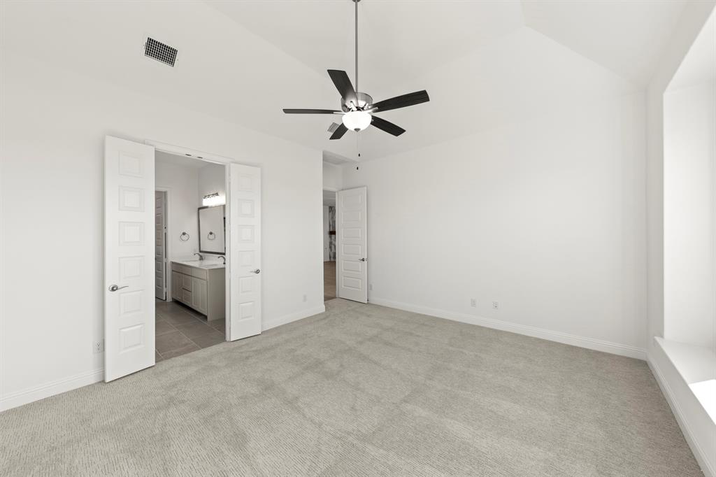 3306 Agnew Street Celina, TX 75009 - Photo 14 of 27 a view of a room with a ceiling fan and refrigerator