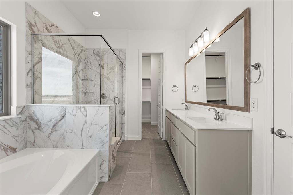 3306 Agnew Street Celina, TX 75009 - Photo 15 of 27 a bathroom with a double vanity sink mirror double and shower