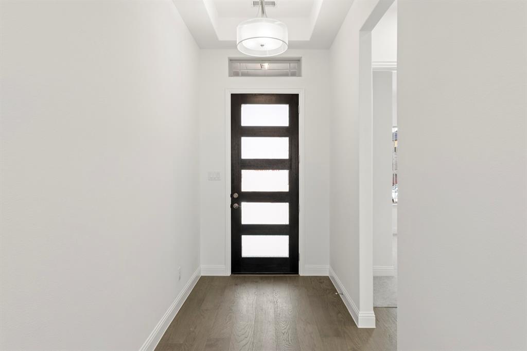 3306 Agnew Street Celina, TX 75009 - Photo 3 of 27 a view of a hallway with wooden floor and a window