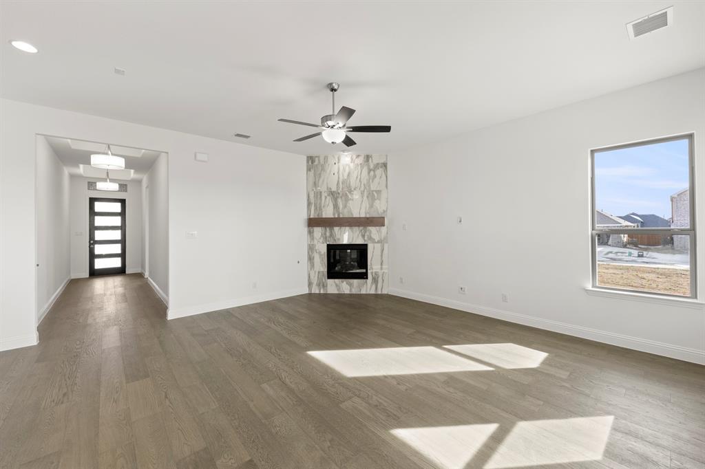 3306 Agnew Street Celina, TX 75009 - Photo 6 of 27 wooden floor in an empty room with a window