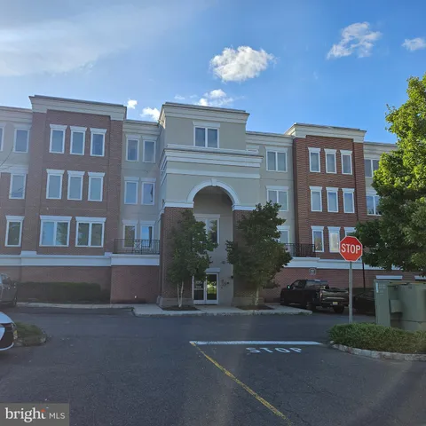 a front view of a building with garden