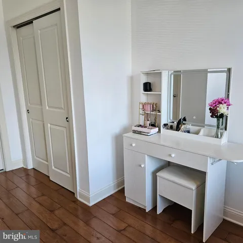 a bathroom with a sink vanity and a mirror