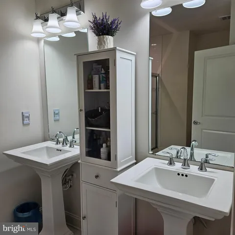 a bathroom with a glass shower door