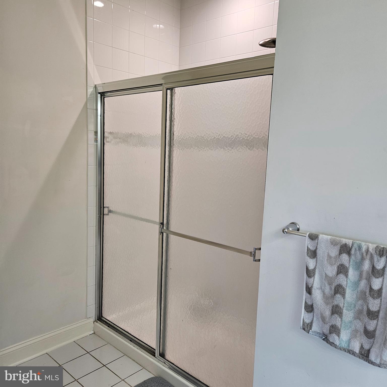 968 Robbinsville Edinburg Road, Unit 305 Robbinsville, NJ 08691 - Photo 20 of 24 a bathroom with a glass shower door