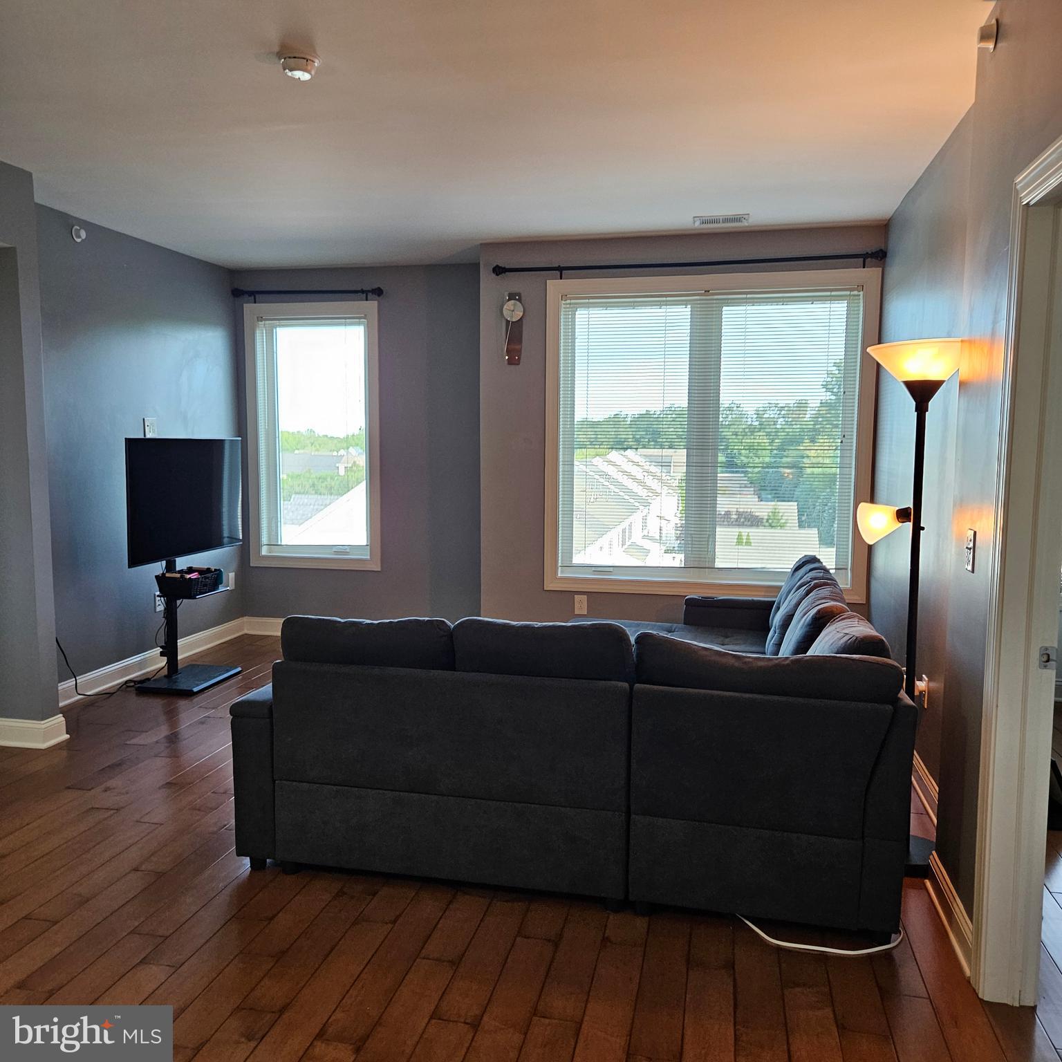 968 Robbinsville Edinburg Road, Unit 305 Robbinsville, NJ 08691 - Photo 6 of 24 a living room with furniture and a flat screen tv