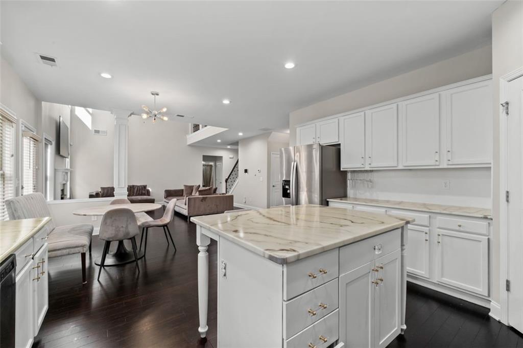 515 Lakeside View Fairburn, GA 30213 - Photo 20 of 43 a open kitchen with stainless steel appliances kitchen island a island in the center