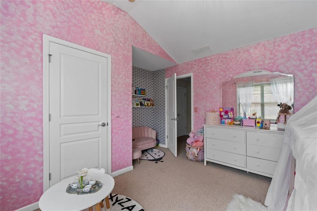 515 Lakeside View Fairburn, GA 30213 - Photo 25 of 43 a bedroom with furniture and a mirror