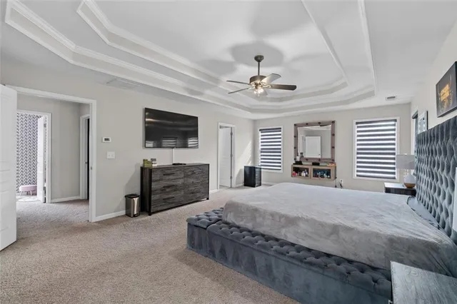 a bathroom with a tub a sink and mirrors