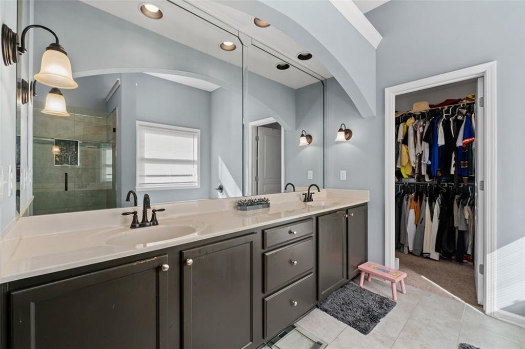 515 Lakeside View Fairburn, GA 30213 - Photo 29 of 43 a bathroom with a double vanity sink and a mirror