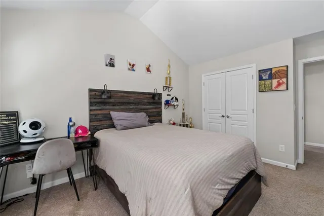 a view of a hallway with wooden floor stairs and windows