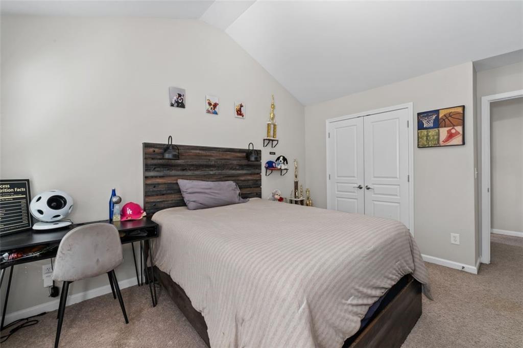 515 Lakeside View Fairburn, GA 30213 - Photo 32 of 43 a bedroom with a bed and a desk