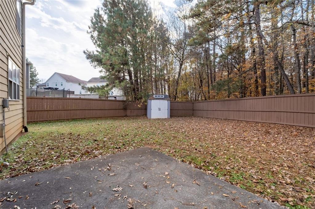 515 Lakeside View Fairburn, GA 30213 - Photo 36 of 43 a view of backyard with wooden fence