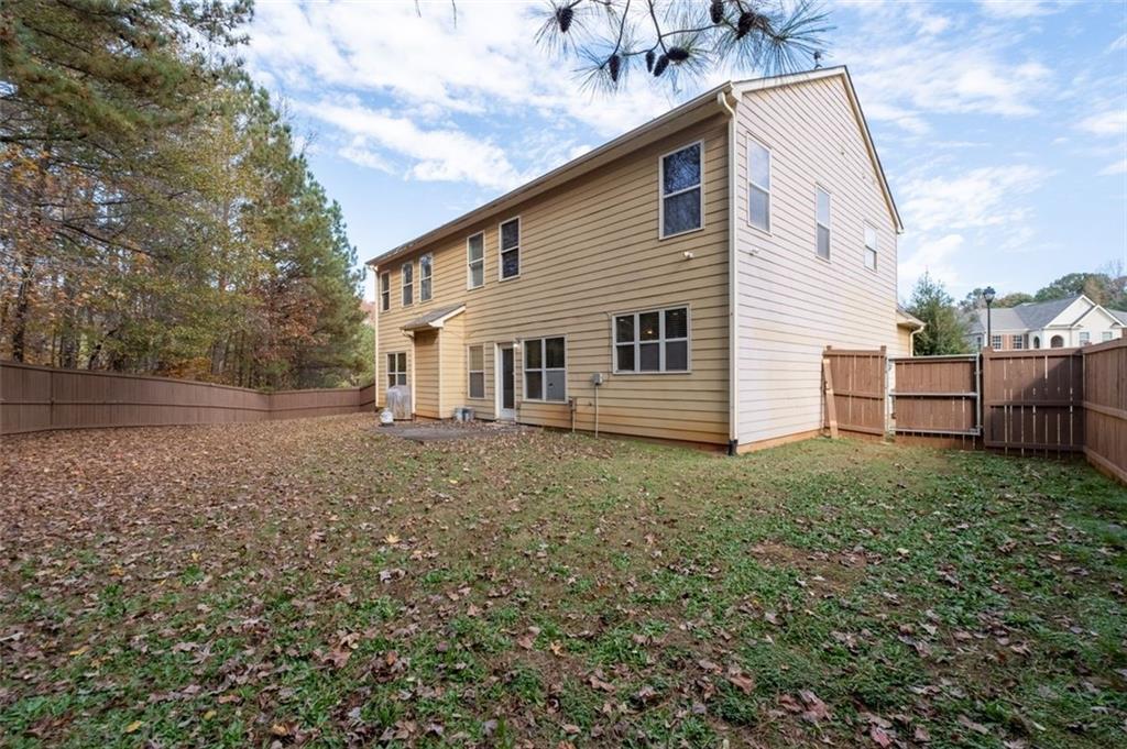 515 Lakeside View Fairburn, GA 30213 - Photo 37 of 43 a view of a house with a backyard