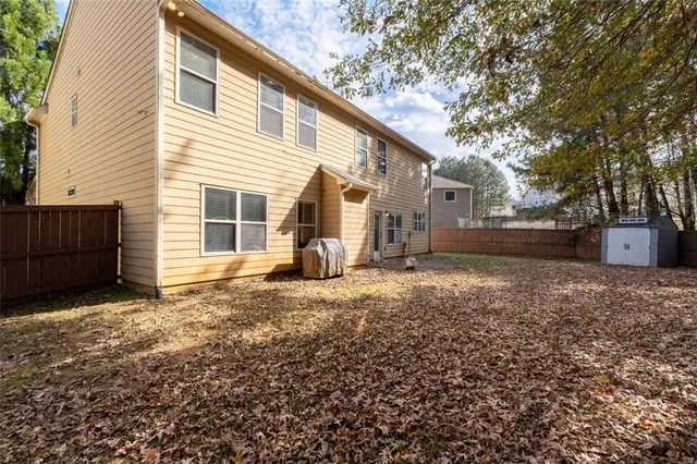 a view of a park with large trees