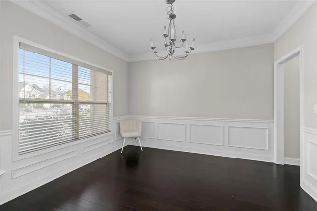 a bathroom with a sink a toilet a mirror and shower