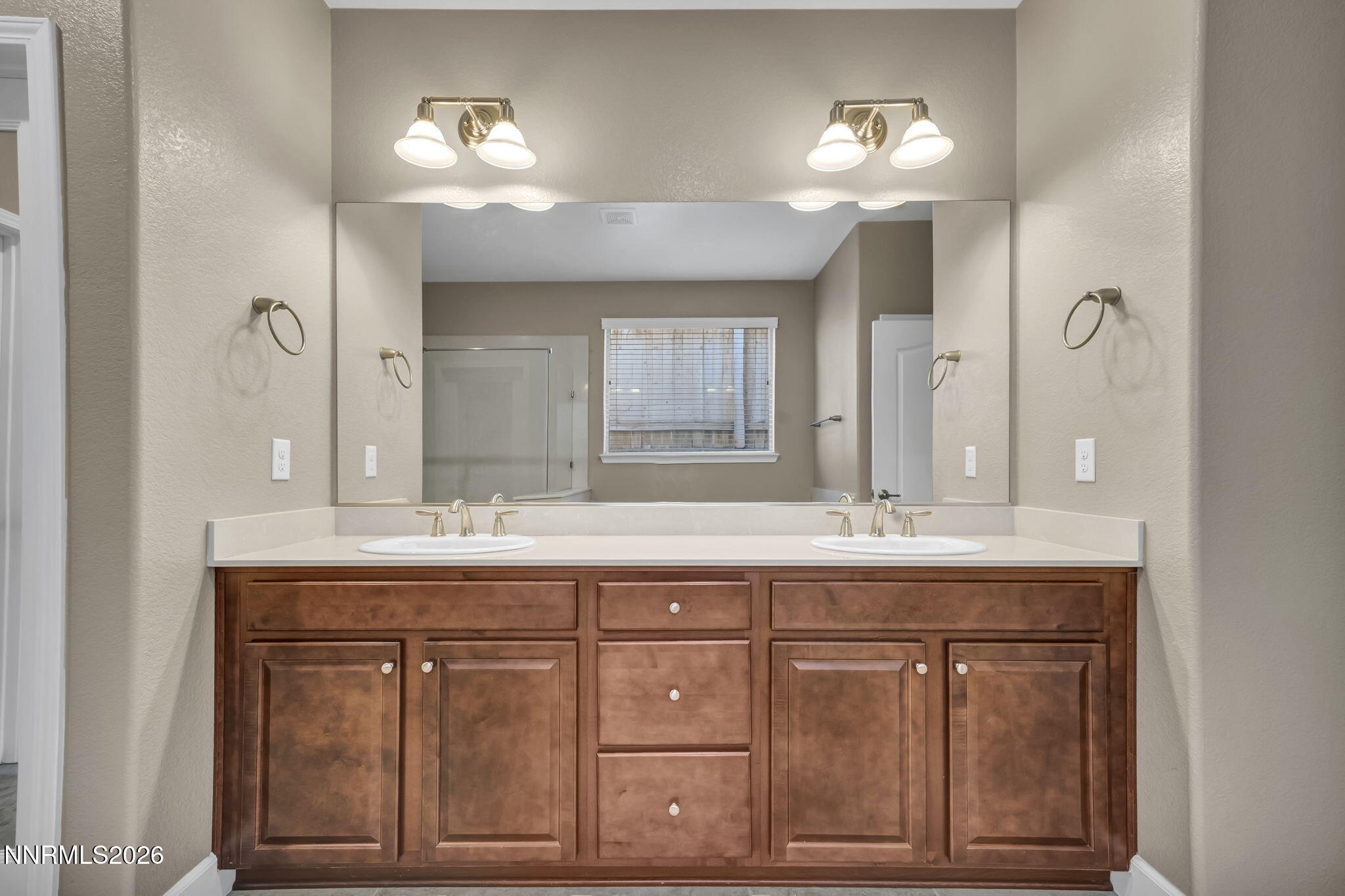 1725 Verdi Vista Court Reno, NV 89523 - Photo 17 of 19 a bathroom with a sink double vanity and a mirror