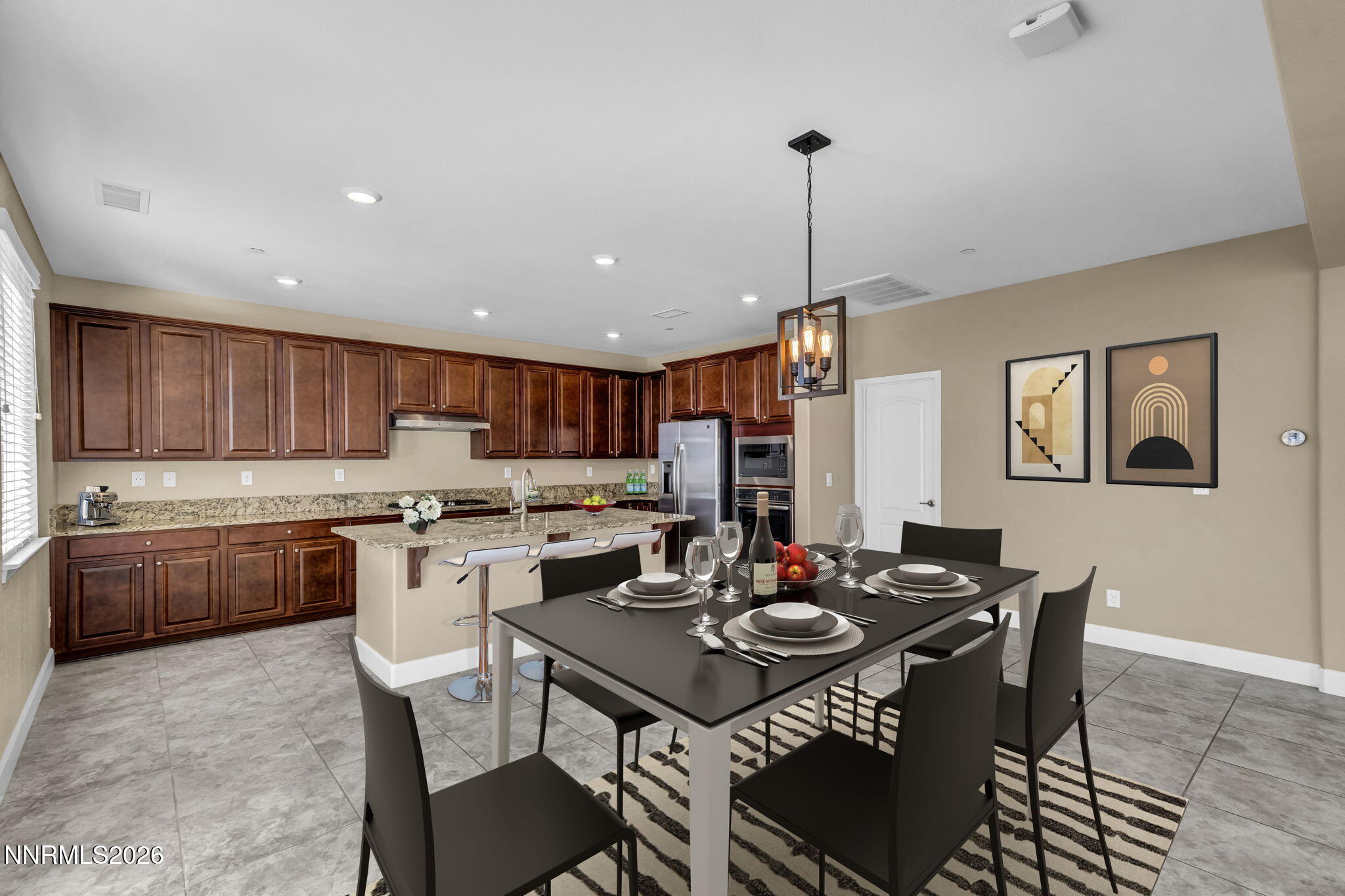 1725 Verdi Vista Court Reno, NV 89523 - Photo 7 of 19 a kitchen that has a table and chairs in it