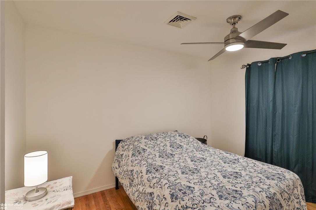 205 West Moorestown Road Wind Gap, PA 18091 - Photo 10 of 20 A comfortable bedroom featuring hardwood floors and a modern ceiling fan.