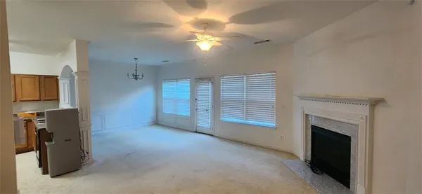 a view of a livingroom with furniture and a fireplace